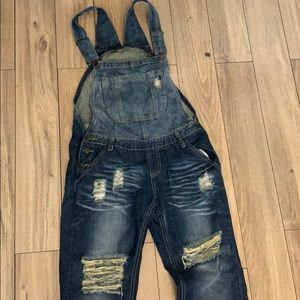 Machine distressed overalls